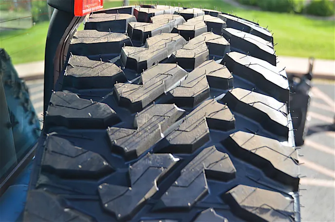 A wide and flat contact shape was designed to increase traction and extend tread life.