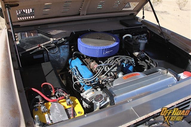 The remanufactured Ford 302 V8 that powers this '68 Bronco is a pretty standard mill, with Pertronix ignition components and a Magnaflow two-into-one muffler serving as the performance modifications versus factory stock. The cooling system has been upgraded substantially though, and sports a Bronco-specific Ron Davis aluminum radiator and shroud with a sacrificial anode type radiator cap. Wildhorses stainless air dams are installed in the top front of the radiator support, which forces much more air through the radiator. Janson also installed a seven-blade mechanical fan blade setup to pull more air through the radiator, a Robert Shaw thermostat, and a beefier aluminum water pump. Though the carbureted mill has served Janson well, he says he has a late model fuel injected 5.0 from a low mileage Explorer that's destined for this engine bay in the near future.