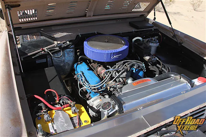 The remanufactured Ford 302 V8 that powers this '68 Bronco is a pretty standard mill, with Pertronix ignition components and a Magnaflow two-into-one muffler serving as the performance modifications versus factory stock. The cooling system has been upgraded substantially though, and sports a Bronco-specific Ron Davis aluminum radiator and shroud with a sacrificial anode type radiator cap. Wildhorses stainless air dams are installed in the top front of the radiator support, which forces much more air through the radiator. Janson also installed a seven-blade mechanical fan blade setup to pull more air through the radiator, a Robert Shaw thermostat, and a beefier aluminum water pump. Though the carbureted mill has served Janson well, he says he has a late model fuel injected 5.0 from a low mileage Explorer that's destined for this engine bay in the near future.