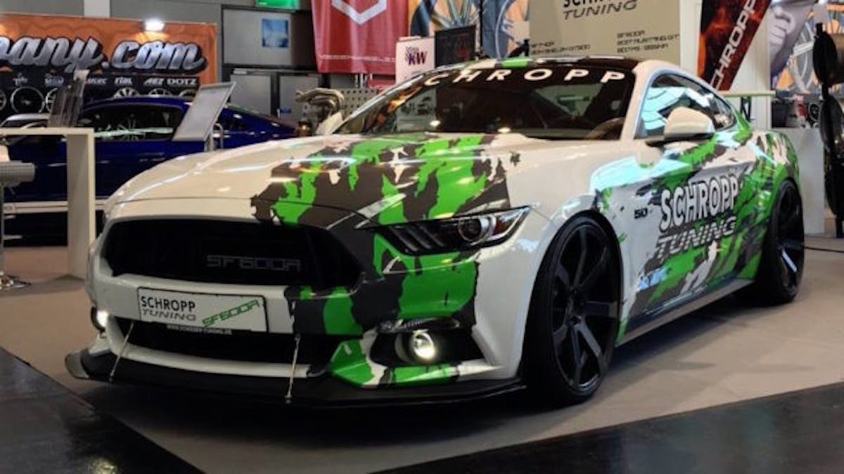Schropp turned to WRAPworks for the hard-to-miss white and green graphics, while the car’s body mods include an R-model-style wing, an open grille and a carbon fiber front splitter. (Photo Credit: Schropp Tuning)