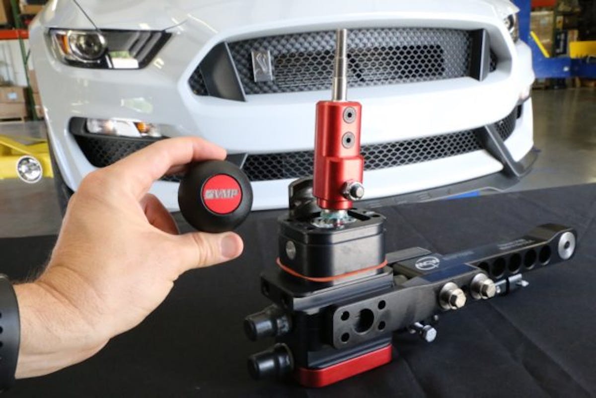 Want better shifting performance in your 2015+ Shelby GT350? MGW Shifters upgrade (PN MGW-RACESPEC15GT350; $450) is said to hold the shift linkage and transmission in “perfect alignment at all times to deliver unmatched shifting precision.” This work of billet art is compatible with the factory shift knob (via and adapter) or one of MGW’s own knobs, like the VMP-emblazoned Gripper knob (PN MGW-SHIFTKNOB; $50) shown here.