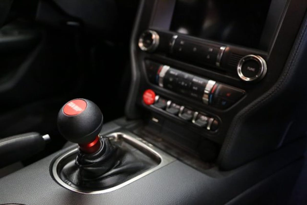 If you are retaining the stock shift knob, you will need to utilize the optional OEM Knob Adapter ($20). Since VMP offers its own MGW Gripper knob, Justin obviously selected that knob, which just screws right on with no adapter.