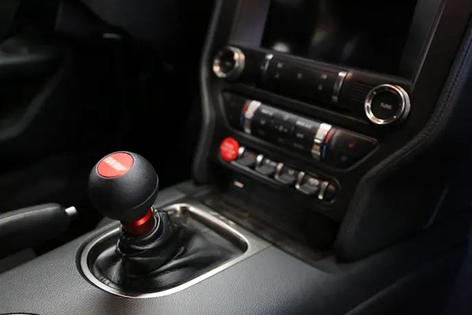 If you are retaining the stock shift knob, you will need to utilize the optional OEM Knob Adapter ($20). Since VMP offers its own MGW Gripper knob, Justin obviously selected that knob, which just screws right on with no adapter.