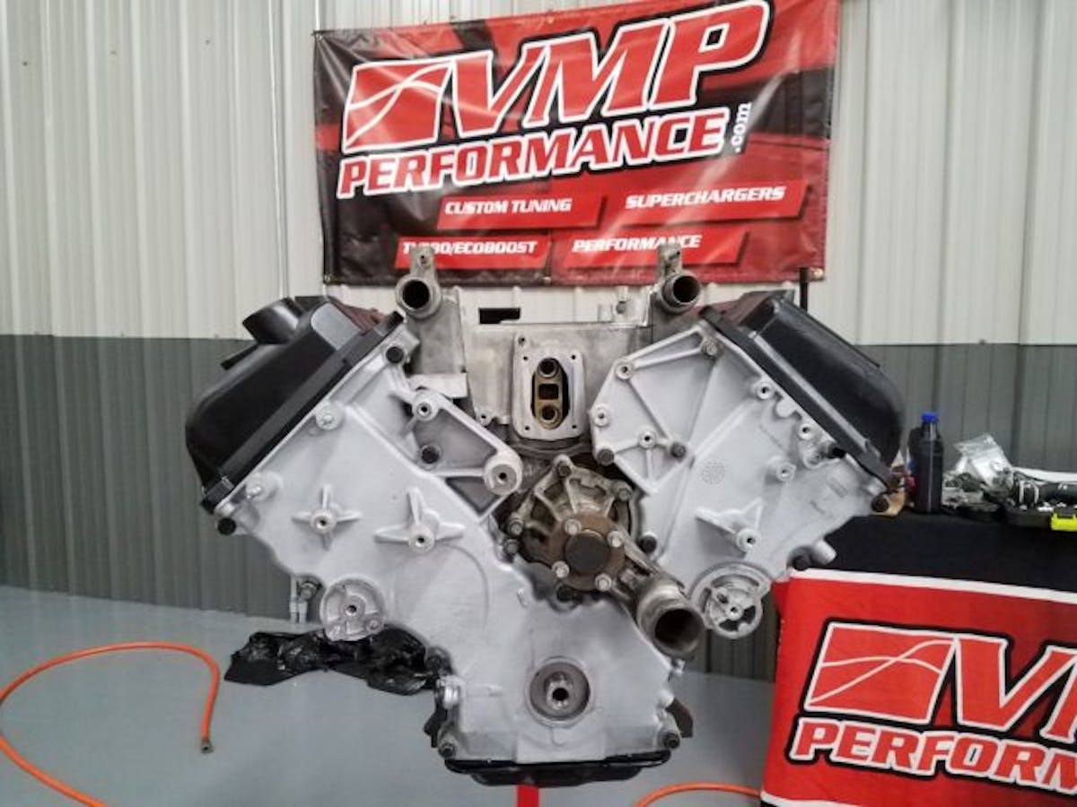 Next he installed the timing cover, cam covers, and lower intake using all new Ford gaskets and seals.