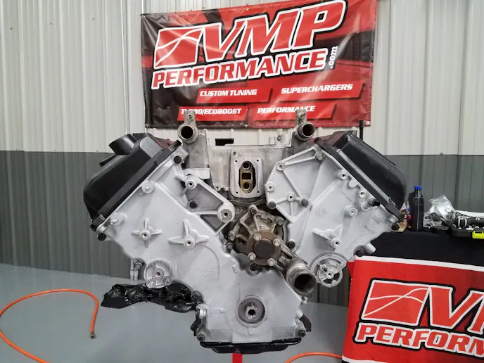 Next he installed the timing cover, cam covers, and lower intake using all new Ford gaskets and seals.