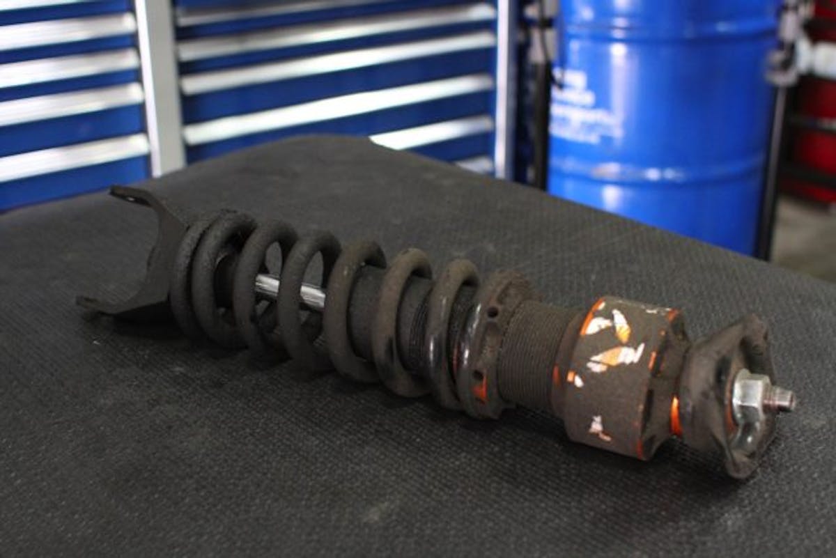 Here's what a coilover looks like after three years of daily driver use and almost 30,000 miles. Fortunately, a factory rebuild will bring our set back to like-new condition.