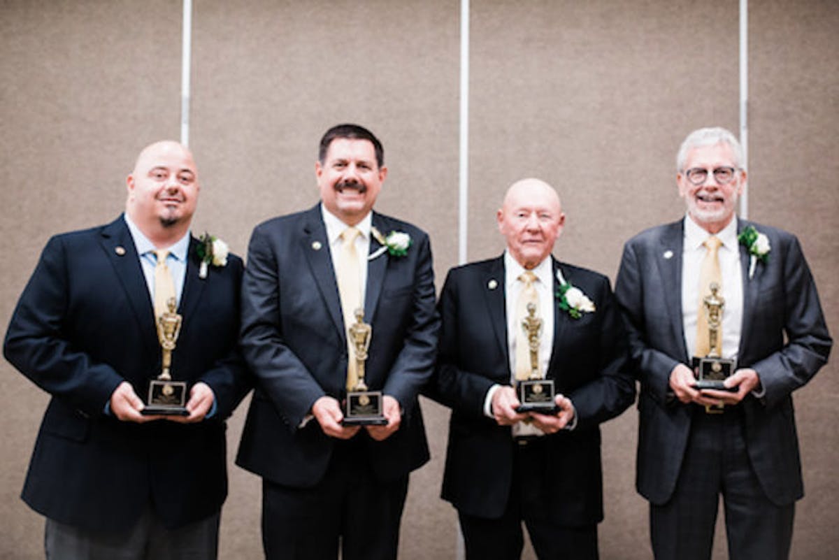 The four honorees (left to right): Gary Romano, Michael Downs, Walker Evans, and Jim Clover.