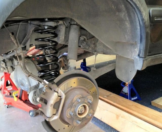 Swapping air suspension for coil springs.
