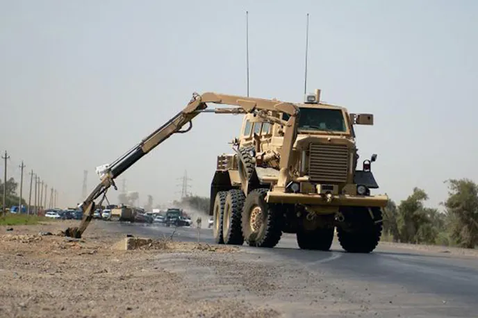 Not long after Allied troops arrived in Iraq in 2004 it became clear that the military's go-to convoy vehicle, the Humvee, was ill equipped to handle the dangers of roadside bombs, which would soon contribute to a substantial amount of Allied casualties. Minimally armored, the Humvee was never designed to withstand blasts originating from underneath the vehicle, and such attacks could not only disable the vehicle, the force of the blast could bend the Humvee's chassis enough to prevent the doors from opening, trapping occupants inside. Though efforts were made to retrofit Humvees with additional armor, the added weight made the vehicles less capable and were considered marginally beneficial, so the U.S. government began to seek a more comprehensive solution to the problem. A key feature of MRAP vehicles like the Buffalo is the "V" shaped monohull chassis, which is specifically designed to redirect the blast out and away from the vehicle's passenger area. Image: Military.com