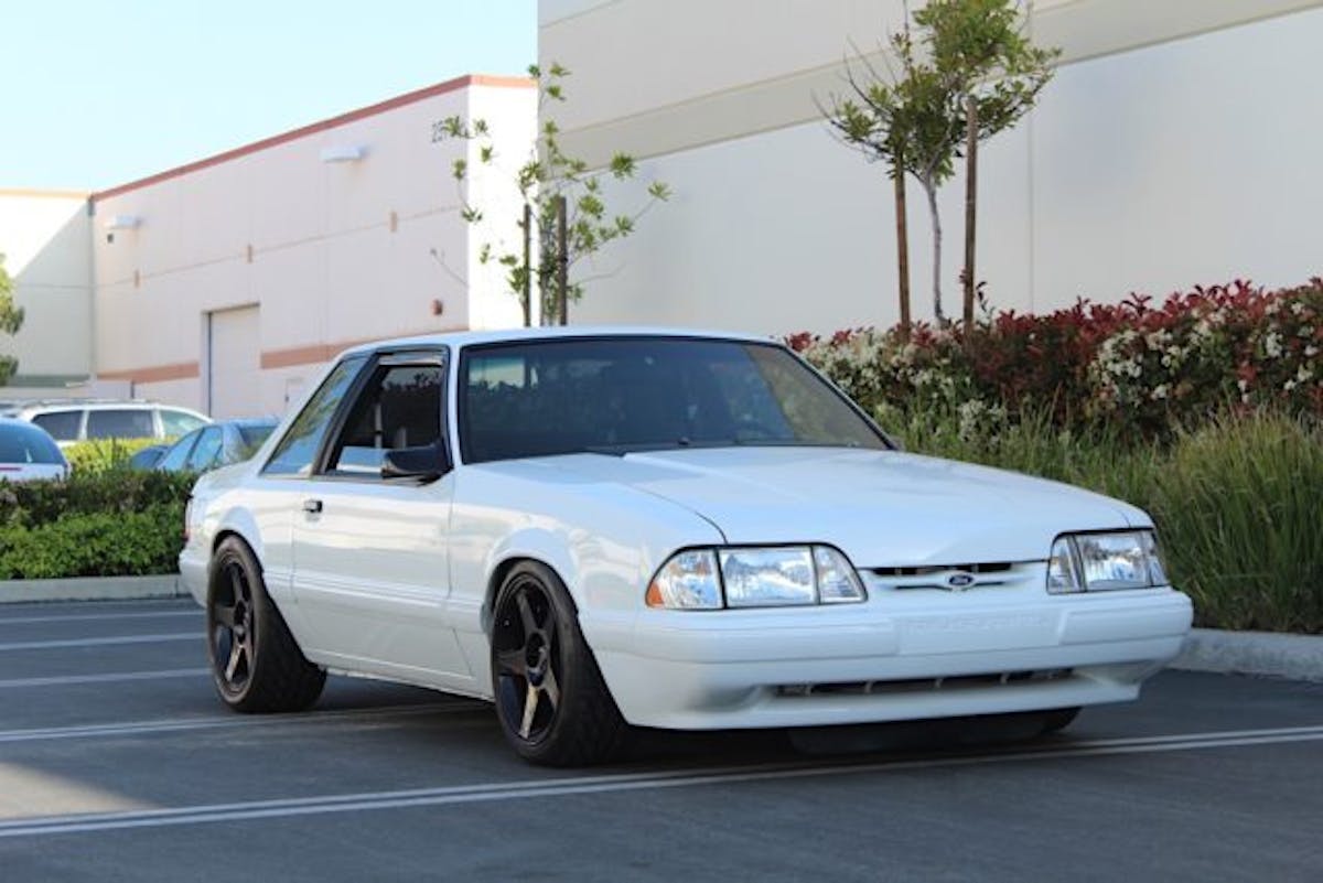 When this '92 LX rolled off the assembly line it was packing 225 horsepower. While the factory braking system provides adequate stopping power for a stock example of this vintage, this particular Fox body's 5.0 has been upgraded significantly, and the addition of a Vortech supercharger into the mix means that it's capable of reaching high speeds in significantly less distance than it could from the factory, and that in turn means a lot more work for the braking system. In order to maintain balanced capability, the brakes need to be every bit as capable at their task as any other performance component.