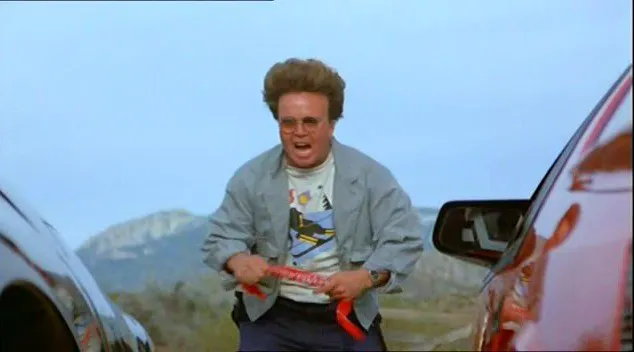 Rughead (Clint Howard) starts a drag race.