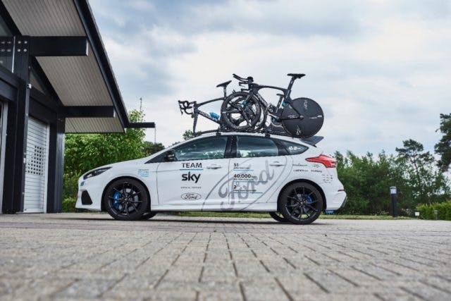One of 25 Ford support vehicles deployed by Team Sky, this 2017 Focus RS Option Pack features a Team Sky livery, a bike rack, custom Recaro seats, and more.