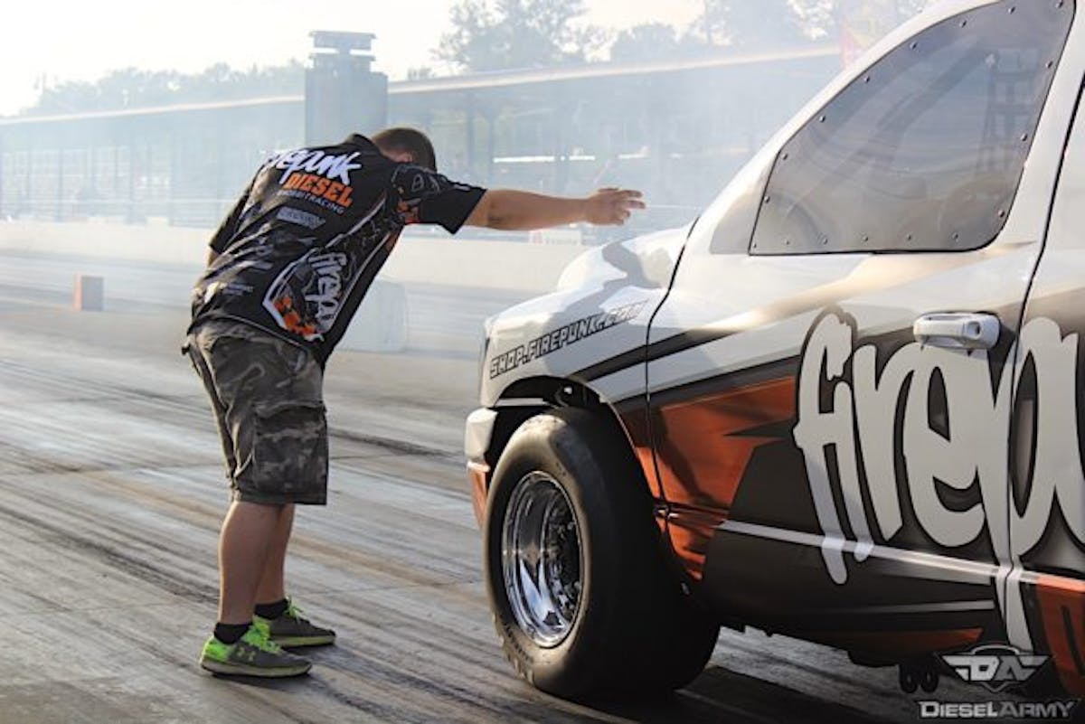 Pro Street winner Lavon Miller bumping in to the stage beams with the help of his brother Larson.