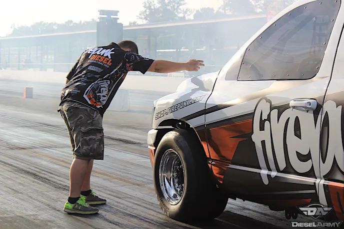 Pro Street winner Lavon Miller bumping in to the stage beams with the help of his brother Larson.