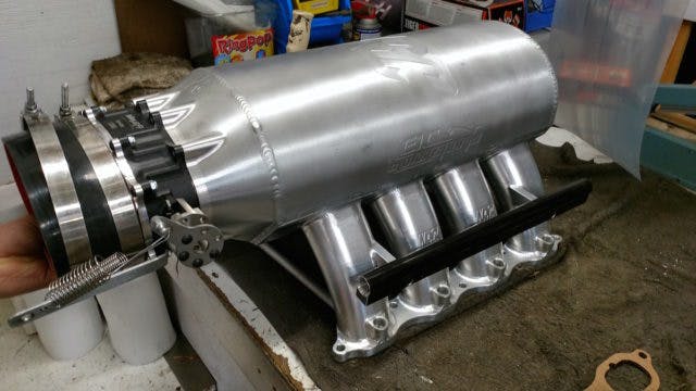 To feed this 358-cube Coyote and withstand the boost from a 98mm turbocharger, John turned to Naiser Racing for a short-runner, big plenum sheetmetal intake fitted with a Holley Pro Stock oval throttle body that fits within the Street Outlaw regulations. It is fitted with eight 220 lb/hr injectors fed by a Weldon 1600 fuel pump and controlled by a MoTec M800 engine management system.