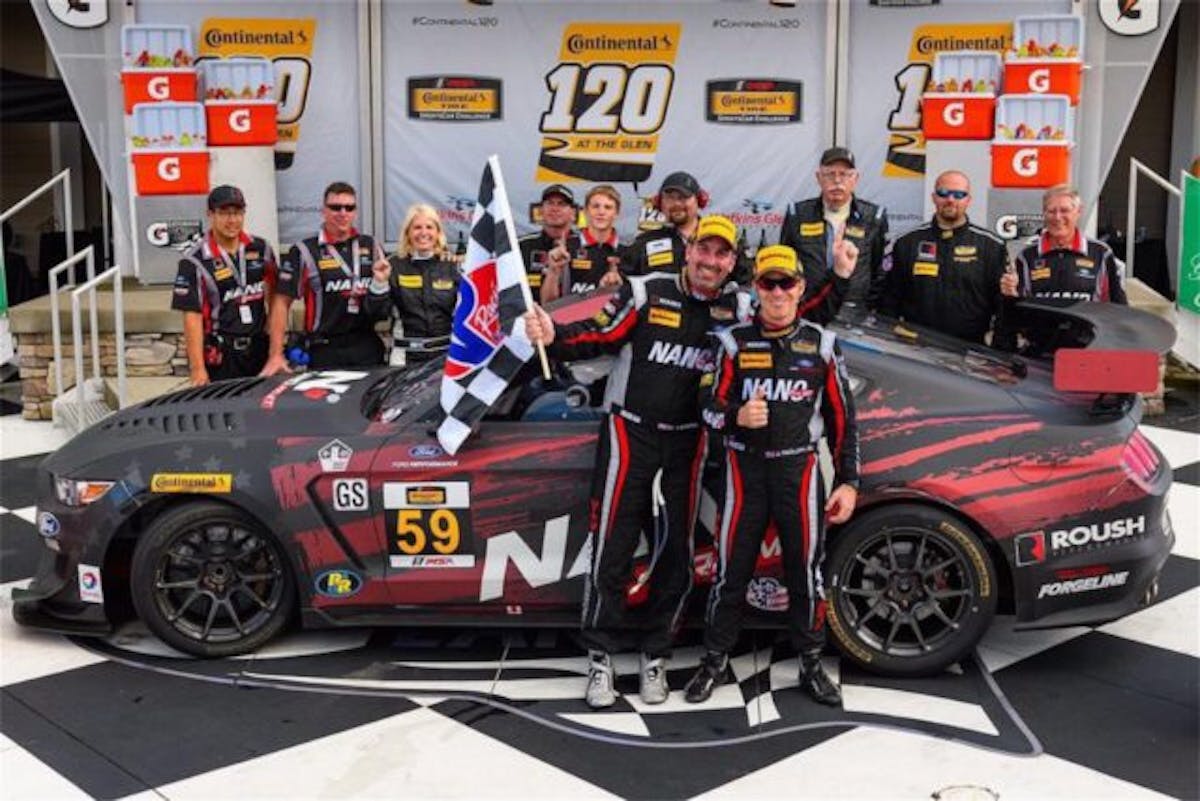 Dean Martin and co-driver Jack Roush Jr. put the No. 59 NANO ProMT Ford Mustang at the top of the Continental Tire 120 podium at Watkins Glen International.
