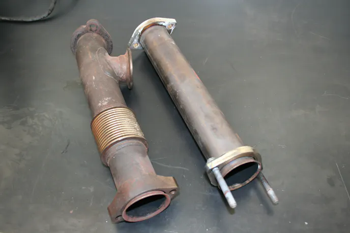 photo comparing up pipes for an EGR cooler and without