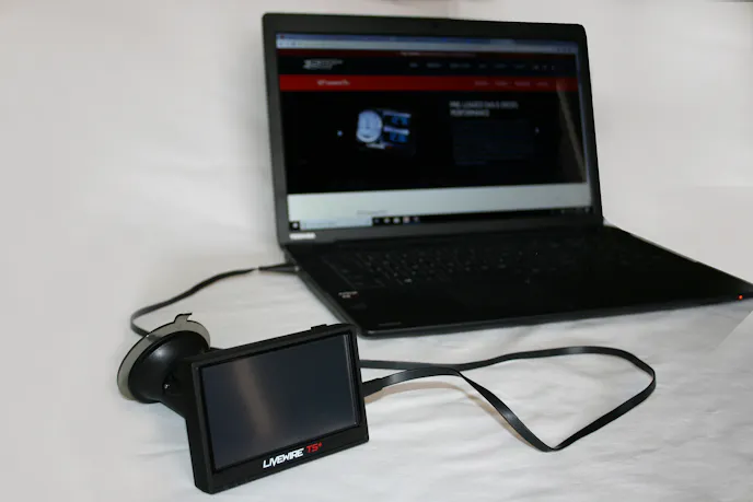 Image shows the SCT Livewire TS+ monitor plugged into a laptop