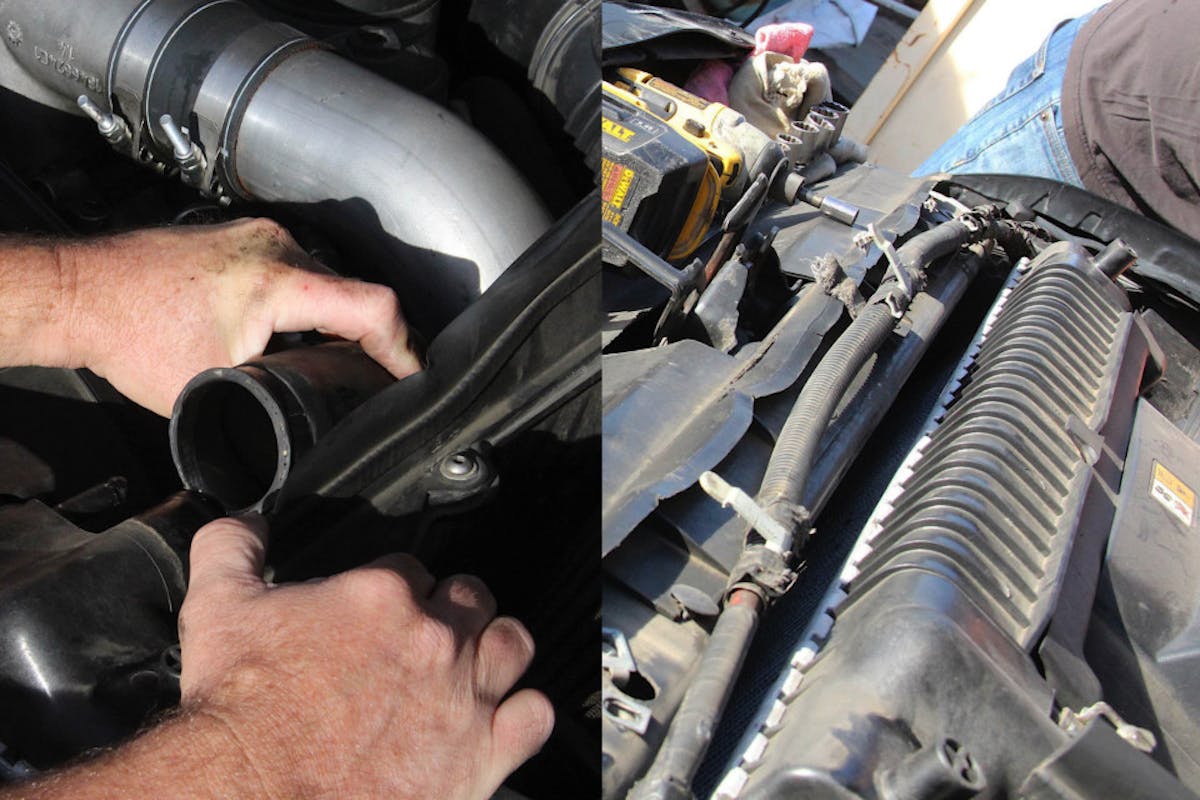 image of battery cable moved out of the way. Image of upper radiator hose disconnected from radiator