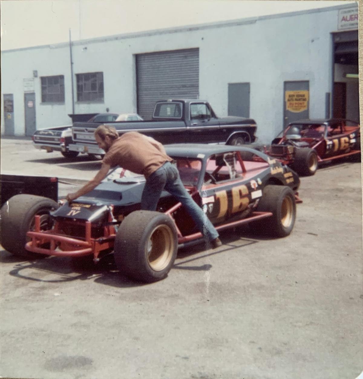 Richard's father makes final adjustments before loading up his Nascar Modifieds onto a trailer outside of his shop.