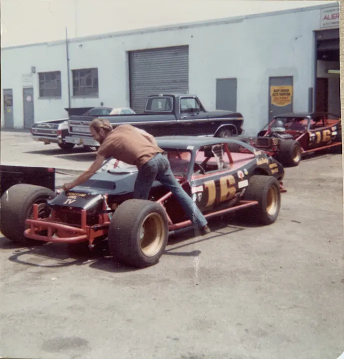 Richard's father makes final adjustments before loading up his Nascar Modifieds onto a trailer outside of his shop.