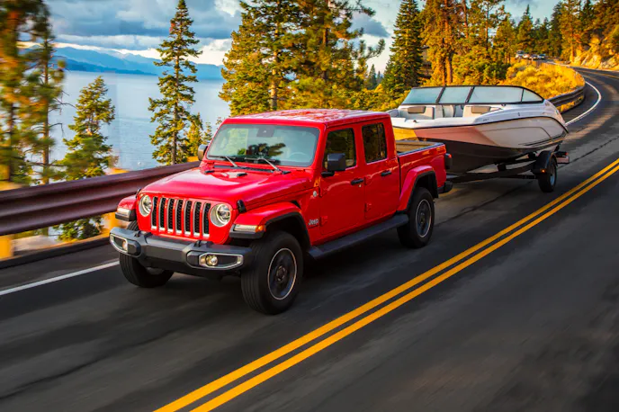 Jeep Gladiator towing boat highway