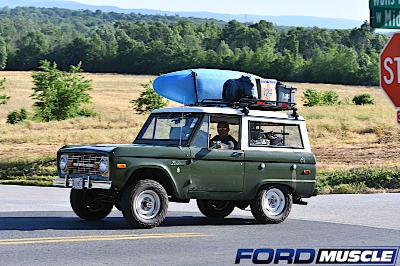 Classic Ford Bronco with kayak on roof