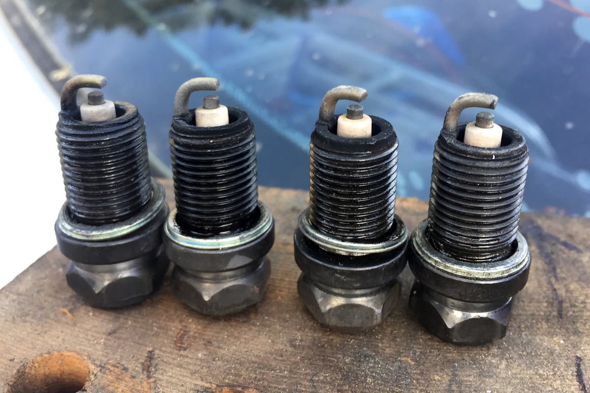 oil on spark plug threads