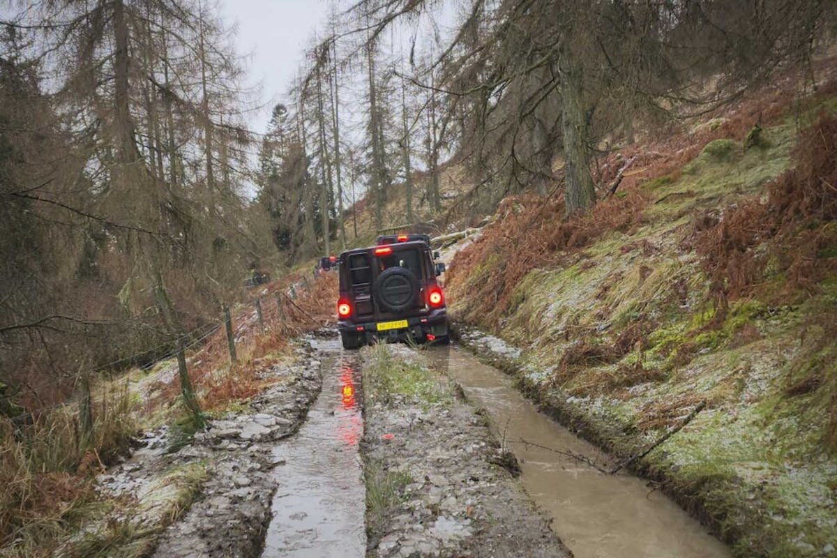 Mud-filled chutes gave way to moss-encrusted hillsides and rocky trails—the perfect place to try the Grenadier’s Off-Road mode while in low range. Photo: Mercedes Lilienthal
