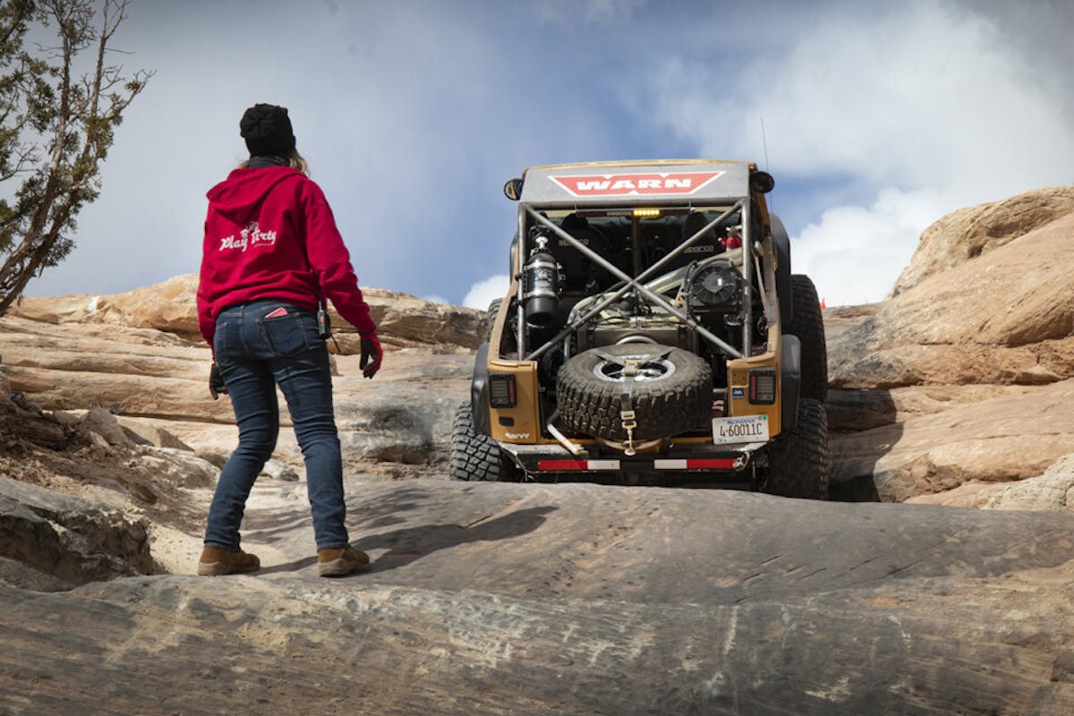 Goldie Rocks climbing up Wipeout Hill, with spotter Nena Barlow ready to help.