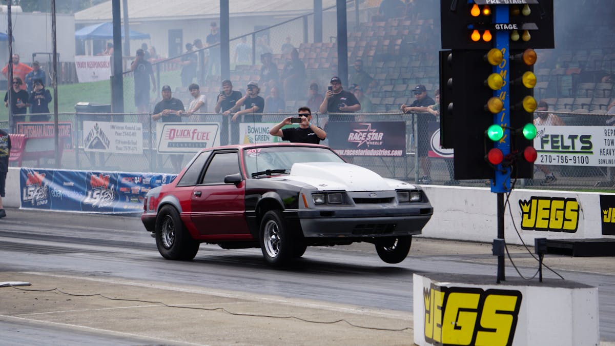 Foxbody doing a wheelie