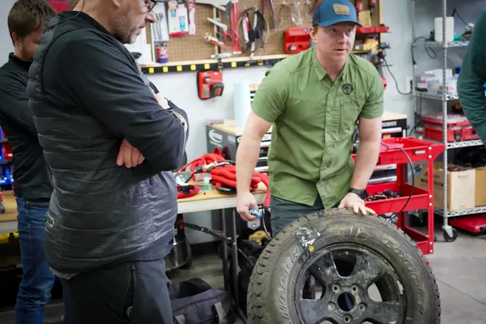 Brent Baker, co-owner of Oregon AT showing how to fix a tire. 