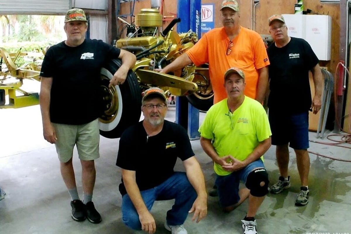 gold 1955 Chevy tribute car build team