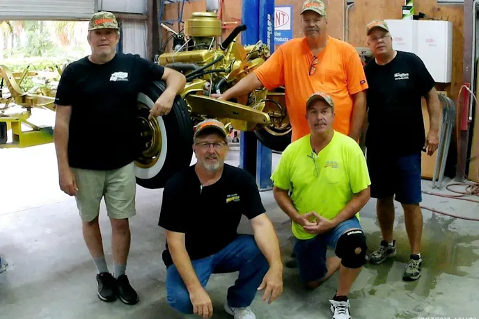 gold 1955 Chevy tribute car build team