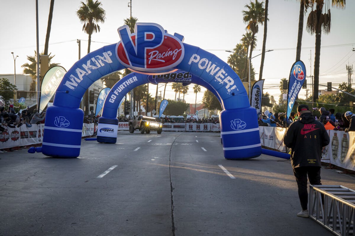 Bryce Menzies, Gustavo "Tavo" Vildósola Jr., and Andy McMillin with their Mason-built AWD #7 SCORE Red Bull Ford Raptor trophy truck crossed the finish line in 1st place.