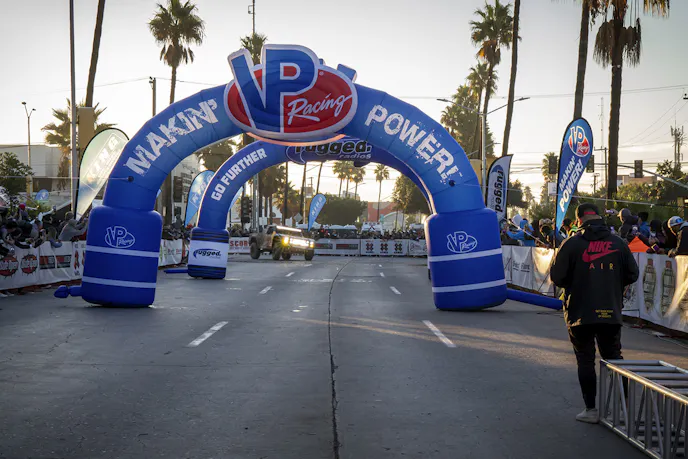 Bryce Menzies, Gustavo "Tavo" Vildósola Jr., and Andy McMillin with their Mason-built AWD #7 SCORE Red Bull Ford Raptor trophy truck crossed the finish line in 1st place.