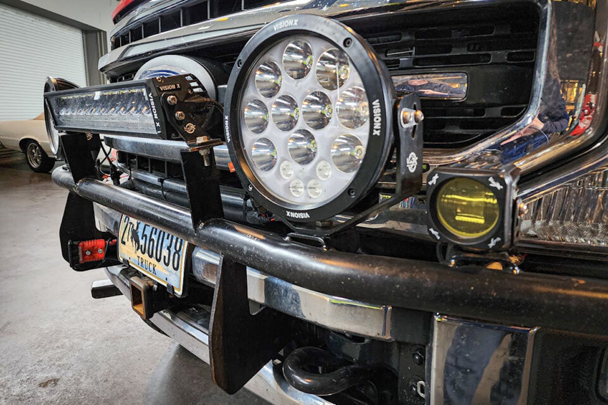 Light bar, auxiliary lights, and chrome grille on customized truck