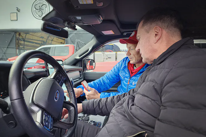 Alexei Safonov (left) and a friend work together to bring up leg #1 of the trip's navigation. Photo: Mercedes Lilienthal