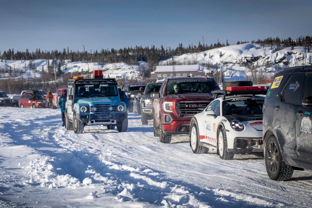 2024 INEOS Grenadier Trialmaster in line with other vehicles on Great Slave Lake for ice racing during the 2024 Alcan 5000 Rally