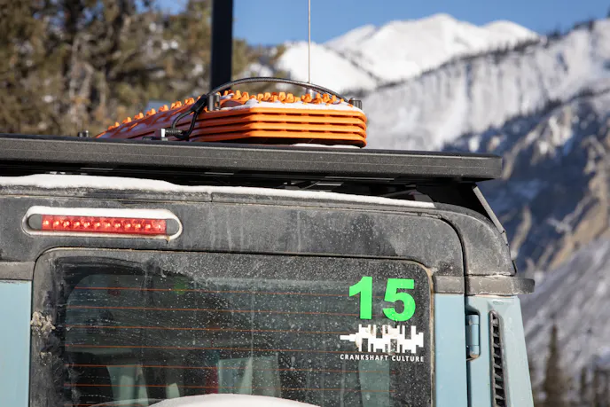 Rhino-Rack Pioneer platform rack housing a double jerry can holder and four MAXTRAX recovery boards.