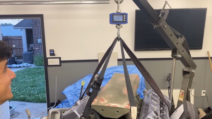 the Ford V10 engine is being weighed using a scale