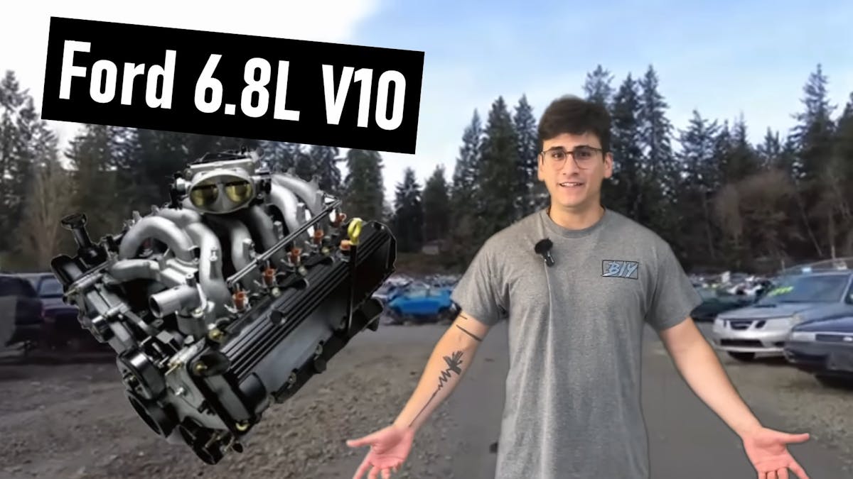 Man standing up with Ford 6.8L V10 hovering beside him