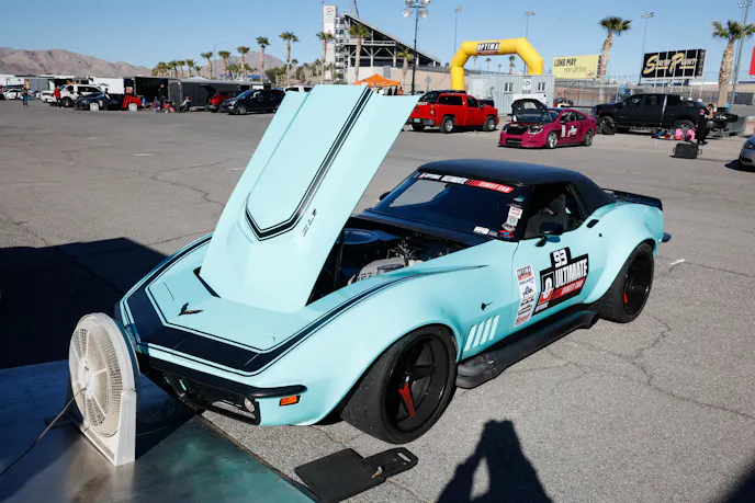 OUSCI candidate in the tracks; teal car