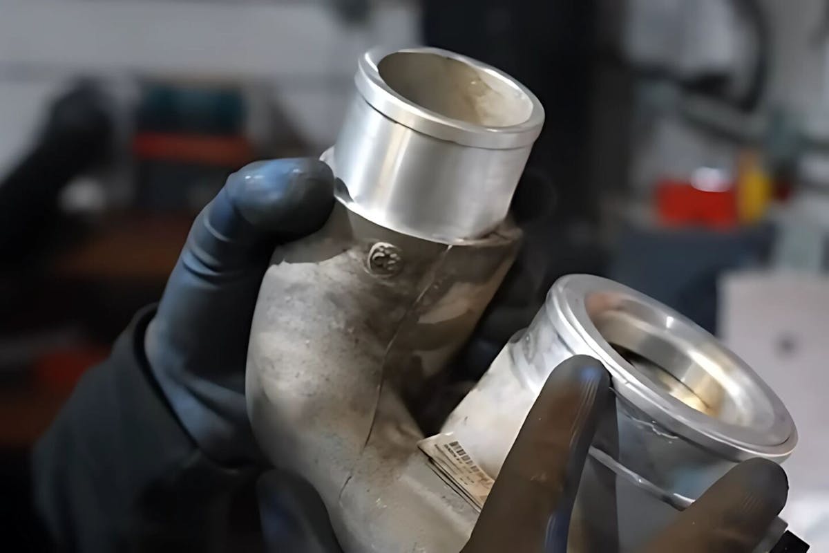 an image of a held turbo silencer