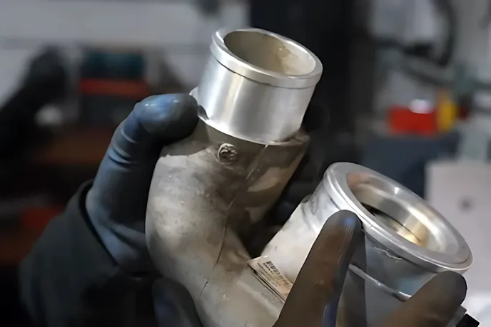 an image of a held turbo silencer