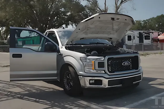 Ford F-120 car with open hood and open door