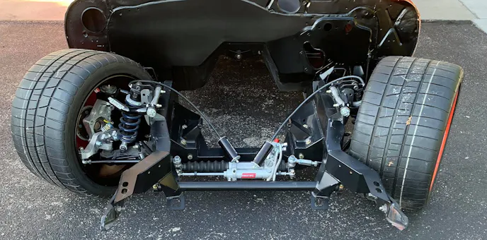 tire clearance and improved geometry of an aftermarket chassis