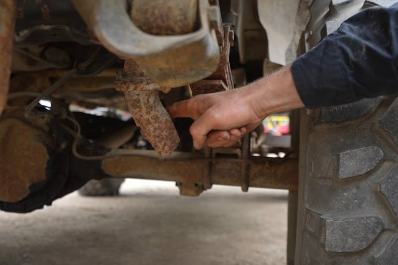 Rusting parts of an old '80s Chevrolet Camaro