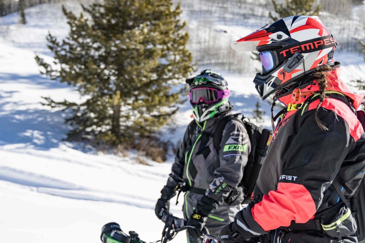 2 men doing outdoor activities on a snowy day