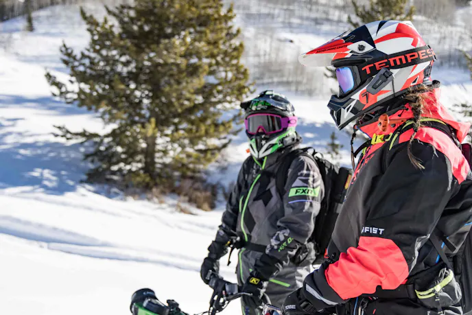 2 men doing outdoor activities on a snowy day